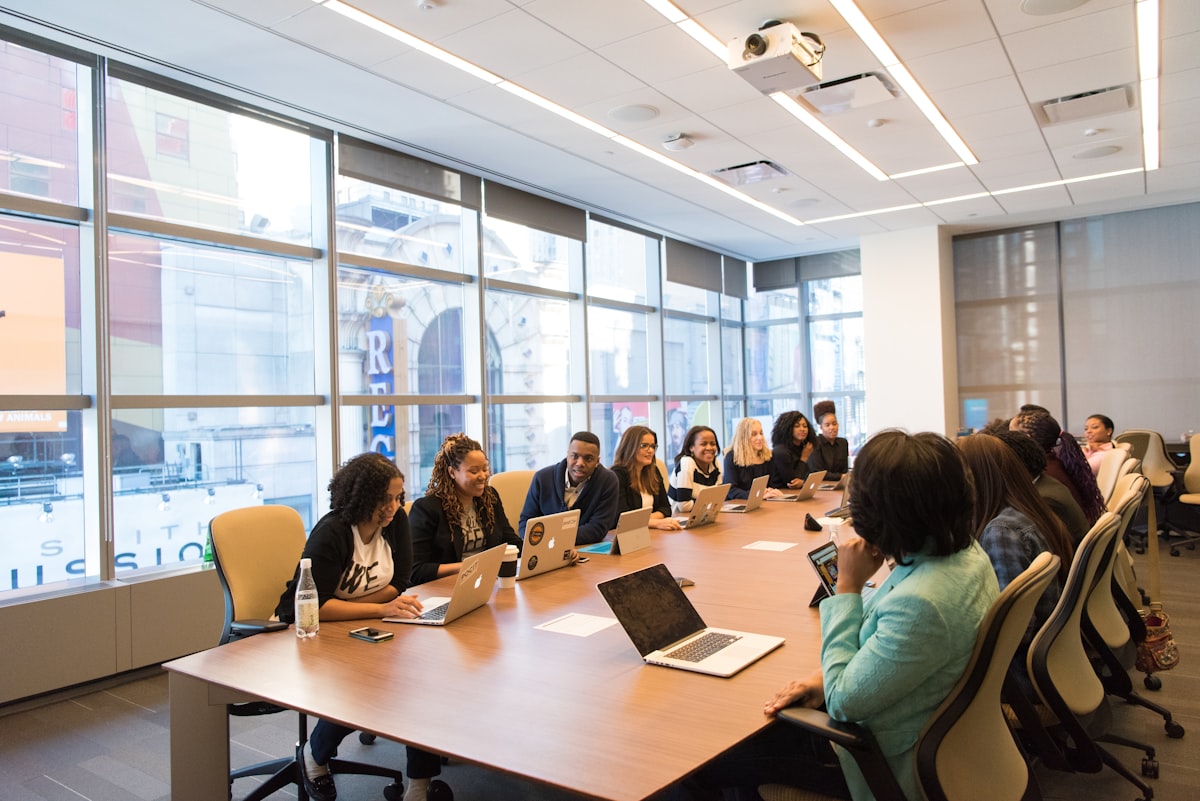 A team of professionals planning together around a boardroom table