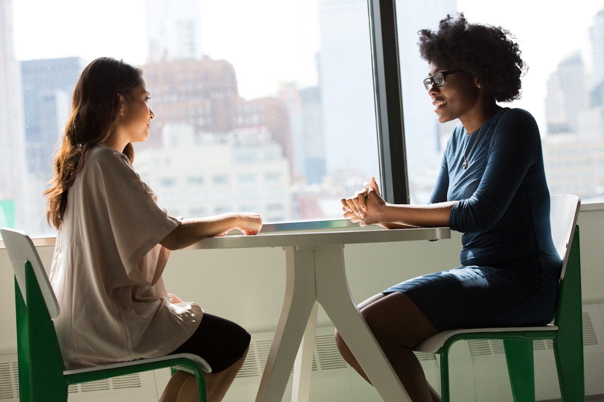 Two professionals in a one-on-one advisory conversation